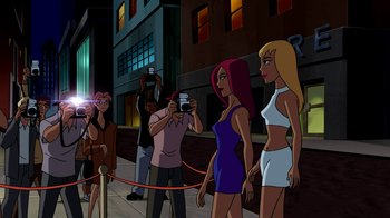 Movie still from “Superman: Doomsday” (2007), directed by Bruce Timm – A group of people standing on a sidewalk; Wide shot, Over the shoulder angle