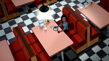 Movie still from “Superman: Doomsday” (2007), directed by Bruce Timm – An animated woman sitting at a table in front of a computer; Extreme Wide shot, High angle