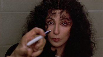 Movie still from “Suspect” (1987), directed by Peter Yates – A person holding a pen; Close Up shot, Over the shoulder angle