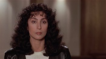 Movie still from “Suspect” (1987), directed by Peter Yates – A person with long hair; Close Up shot, High angle