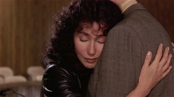 Movie still from “Suspect” (1987), directed by Peter Yates – A person hugging another person; Close Up shot, High angle