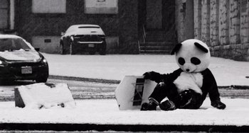 Movie still from “Sweet Thing” (2020), directed by Alexandre Rockwell – A stuffed animal sitting on the ground in the snow; Wide shot, Low angle