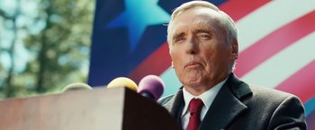 Movie still from “Swing Vote” (2008), directed by Joshua Michael Stern – An older man is speaking at a political event; Close Up shot, Low angle