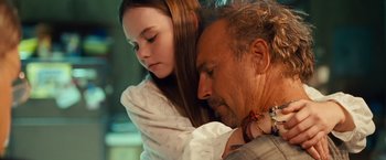 Movie still from “Swing Vote” (2008), directed by Joshua Michael Stern – A man and a young girl sitting next to each other; Close Up shot, Over the shoulder angle