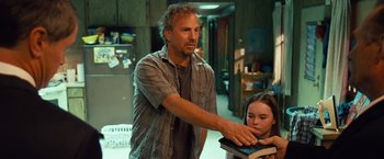 Movie still from “Swing Vote” (2008), directed by Joshua Michael Stern – A man and a little girl in a kitchen; Medium shot, Over the shoulder angle