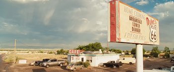 Movie still from “Swing Vote” (2008), directed by Joshua Michael Stern – An old diner with cars parked in front of it; Extreme Wide shot, Low angle