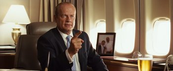 Movie still from “Swing Vote” (2008), directed by Joshua Michael Stern – A man in a suit and tie pointing to the camera; Medium shot, Low angle