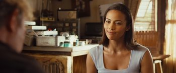 Movie still from “Swing Vote” (2008), directed by Joshua Michael Stern – A beautiful young woman sitting in a kitchen; Close Up shot, Over the shoulder angle