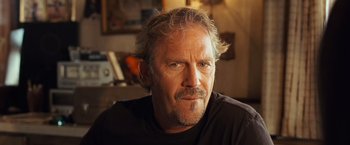 Movie still from “Swing Vote” (2008), directed by Joshua Michael Stern – A person wearing a black t - shirt; Close Up shot, Low angle