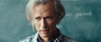 Movie still from “Swing Vote” (2008), directed by Joshua Michael Stern – An older man with grey hair is looking at the camera; Close Up shot, Over the shoulder angle