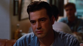 Movie still from “Swingers” (1996), directed by Doug Liman – A person wearing a blue shirt; Close Up shot, Low angle