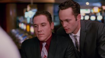 Movie still from “Swingers” (1996), directed by Doug Liman – A couple of men sitting next to each other; Close Up shot, Low angle