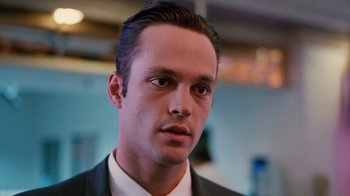 Movie still from “Swingers” (1996), directed by Doug Liman – A person wearing a suit and tie; Close Up shot, Low angle