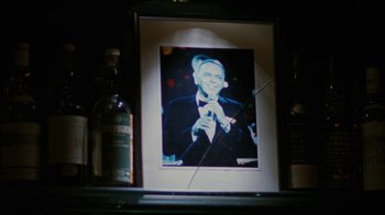 Movie still from “Swingers” (1996), directed by Doug Liman – A picture of a man in a suit and bow tie; Close Up shot, High angle