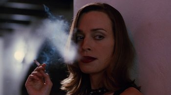 Movie still from “Swingers” (1996), directed by Doug Liman – A woman is smoking a cigarette in front of a mirror; Close Up shot, Low angle