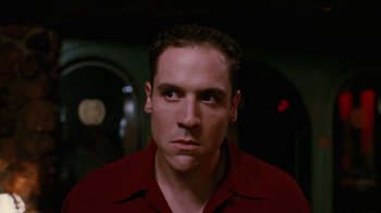 Movie still from “Swingers” (1996), directed by Doug Liman – A person wearing a red shirt; Close Up shot, Low angle