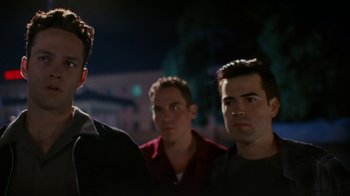 Movie still from “Swingers” (1996), directed by Doug Liman – A group of men standing next to each other in the dark; Close Up shot, Low angle
