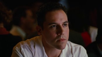 Movie still from “Swingers” (1996), directed by Doug Liman – A person wearing a white shirt; Close Up shot, Low angle