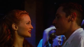 Movie still from “Swingers” (1996), directed by Doug Liman – A man and a woman looking into each others eyes; Close Up shot, Low angle
