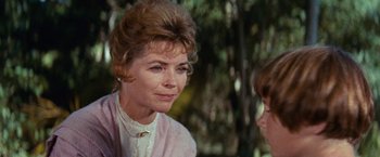 Movie still from “Swiss Family Robinson” (1960), directed by Ken Annakin – An older woman is looking at a younger woman; Close Up shot, Over the shoulder angle