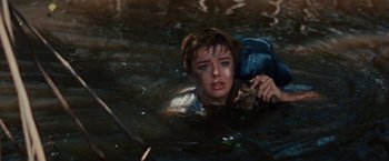 Movie still from “Swiss Family Robinson” (1960), directed by Ken Annakin – A young woman in a body of water; Medium shot, High angle