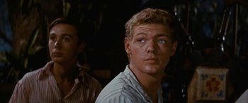 Movie still from “Swiss Family Robinson” (1960), directed by Ken Annakin – A person wearing a striped shirt; Close Up shot, Over the shoulder angle