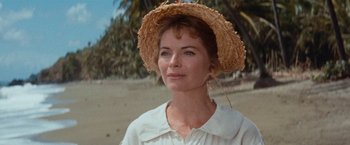 Movie still from “Swiss Family Robinson” (1960), directed by Ken Annakin – A woman wearing a straw hat on the beach; Close Up shot, Low angle