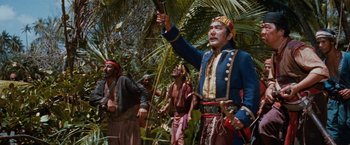Movie still from “Swiss Family Robinson” (1960), directed by Ken Annakin – A group of people in costumes in the woods; Medium shot, Low angle