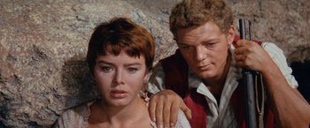 Movie still from “Swiss Family Robinson” (1960), directed by Ken Annakin – A man and a woman standing next to each other; Close Up shot, High angle