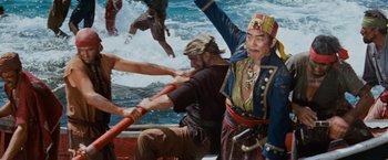 Movie still from “Swiss Family Robinson” (1960), directed by Ken Annakin – A group of people on a boat in the water; Medium shot, High angle