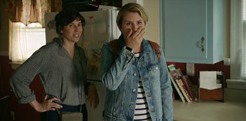 Movie still from “Sword of Trust” (2019), directed by Lynn Shelton – Two women standing in a kitchen and one of the women is covering her mouth; Close Up shot, Over the shoulder angle