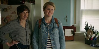 Movie still from “Sword of Trust” (2019), directed by Lynn Shelton – Two women standing next to each other in a room; Medium shot, Over the shoulder angle