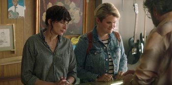 Movie still from “Sword of Trust” (2019), directed by Lynn Shelton – Two women standing next to each other in a room; Medium shot, Over the shoulder angle