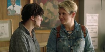 Movie still from “Sword of Trust” (2019), directed by Lynn Shelton – A couple of women standing next to each other; Close Up shot, Over the shoulder angle