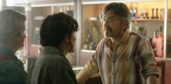Movie still from “Sword of Trust” (2019), directed by Lynn Shelton – An older man and a younger man are talking together; Close Up shot, Over the shoulder angle