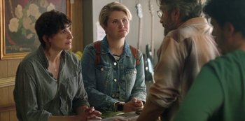 Movie still from “Sword of Trust” (2019), directed by Lynn Shelton – A group of people sitting at a table talking to each other; Medium shot, Over the shoulder angle