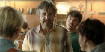 Movie still from “Sword of Trust” (2019), directed by Lynn Shelton – A man with a beard and glasses and a man with a beard and glasses; Close Up shot, Over the shoulder angle