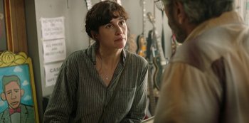 Movie still from “Sword of Trust” (2019), directed by Lynn Shelton – A woman is talking to a man in a store; Close Up shot, Over the shoulder angle