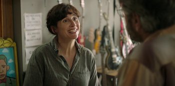 Movie still from “Sword of Trust” (2019), directed by Lynn Shelton – A woman is talking to a man in a store; Close Up shot, Over the shoulder angle