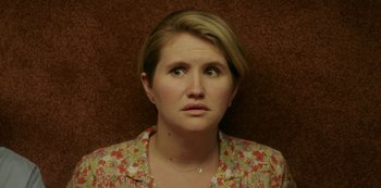 Movie still from “Sword of Trust” (2019), directed by Lynn Shelton – A person wearing a floral shirt; Close Up shot, High angle