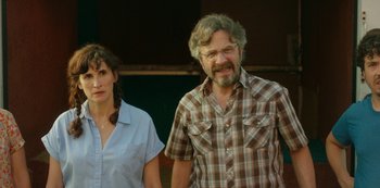 Movie still from “Sword of Trust” (2019), directed by Lynn Shelton – A man and a woman standing next to each other; Medium shot, Over the shoulder angle