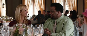 Movie still from “Table 19” (2017), directed by Jeffrey Blitz – A man and a woman sitting at a dinner table; Medium shot, Over the shoulder angle