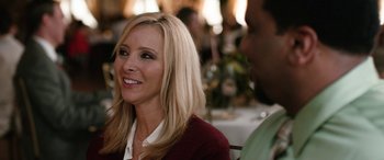 Movie still from “Table 19” (2017), directed by Jeffrey Blitz – A woman sitting in front of a man at a table; Close Up shot, Over the shoulder angle