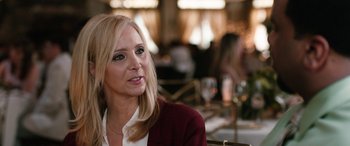 Movie still from “Table 19” (2017), directed by Jeffrey Blitz – A woman sitting at a table in front of a glass of wine; Close Up shot, Over the shoulder angle