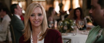 Movie still from “Table 19” (2017), directed by Jeffrey Blitz – A person sitting at a table; Close Up shot, Over the shoulder angle