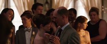 Movie still from “Table 19” (2017), directed by Jeffrey Blitz – A man and a woman dancing together at a wedding; Close Up shot, Over the shoulder angle