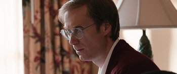 Movie still from “Table 19” (2017), directed by Jeffrey Blitz – A person wearing glasses; Close Up shot, Over the shoulder angle