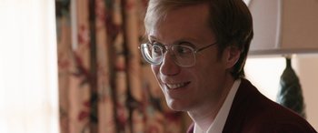 Movie still from “Table 19” (2017), directed by Jeffrey Blitz – A person wearing glasses; Close Up shot, Over the shoulder angle