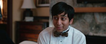Movie still from “Table 19” (2017), directed by Jeffrey Blitz – A man wearing a bow tie and a white shirt; Close Up shot, Over the shoulder angle