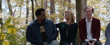 Movie still from “Table 19” (2017), directed by Jeffrey Blitz – A man and a woman sitting next to each other on top of a bench; Medium shot, Over the shoulder angle